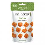 The image shows a vibrant orange-red pack of Mr Filberts Thai Tom Yum Mochi Rice Bites. Bold logo sits above a photo of airy, golden puffed rice bites scattered beside slices of lime, red chili and shrimp, with stylized steam and herb accents.