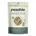 Image shows a clear resealable pouch labeled Peachie Lifestyle, revealing a crunchy mix of walnut halves, a variety of seeds and tiny puffed quinoa clusters coated in glossy tamari. Earthy browns and golden seeds contrast with the dark glaze, with a minimalist white label. On pale wooden board top.