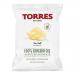 A glossy green-and-cream 125g bag shows the TORRES logo across the top, an illustrated avocado and scattered salt crystals beside a pile of ridged potato crisps. The packaging features bold typography, snack imagery and nutrition icons against a clean background.