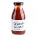 A photo shows six identical Hawkshead Relish Sriracha Ketchup bottles standing in two rows. Clear bottles reveal bright red sauce; white labels feature the Hawkshead logo and bold red lettering. Red caps top each bottle against a plain white background.