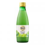 A clear glass bottle of Biona Organic lime juice stands upright with a bright green label and images of sliced limes. The pale green liquid glows inside. Scattered around the bottle lie small piles of grains and dried ingredients on a white background, with soft studio lighting. Subtle studio sheen