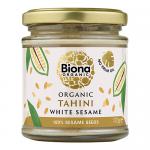 Clear glass jar displays pale, creamy tahini with a smooth, slightly glossy surface. A white paper label encircles the jar, featuring a green Biona logo and minimalist black and brown lettering stating Organic Tahini White No Salt Not Roasted 170g. A silver lid tops the jar.
