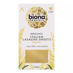 A rectangular pack shows the Biona Organic logo on a white-and-green background; a vivid photo of layered lasagne fills the front, with wheat graphics and the product name in bold green type. Clean edges, small icons and ingredient text appear along the bottom. A small green leaf sits by the corner.