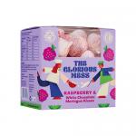 A cluster of small meringue kisses sits on parchment, each pale pink swirl topped with white chocolate streaks and fine raspberry dust. Glossy peaks and delicate cracked shells reveal airy interiors. Scattered crumbs and soft shadows add textured contrast to the scene.
