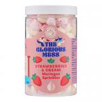 A scattered mix of tiny meringue kisses in soft pink and creamy white, with swirls, chips and irregular shards. Fine sugar crystals glint on the matte surface, creating a delicate, crumbly texture against a neutral backdrop, hinting at strawberry tones and airy lightness. Scattered in a dish nearby