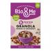 A 360g Bio&Me Cocoa & Hazelnut granola pack stands upright on a plain background. The brown-and-cream packaging shows the Bio&Me logo, photos of hazelnuts, cocoa chunks and oat clusters, with scattered seeds and a spoonful of granola in the foreground.