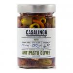 A clear glass jar showcases glossy pitted Italian antipasti olives—green and black—nestled in golden oil with flecks of herbs, thin garlic slices and vibrant red pepper pieces. A modest label wraps the jar, displaying the Casalinga name and simple product information. The oil glints under light now