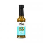 A 150ml clear glass bottle of Eaten Alive jalapeño-and-lime fermented hot sauce stands upright. The bright green sauce shows flecks of pepper and seeds. The colorful label displays jalapeño and lime artwork and bold brand typography; a metal cap seals the bottle.