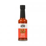 A photo shows ten 150ml glass bottles of Eaten Alive raw kimchi fermented hot sauce arranged in two rows inside a plain cardboard tray. Vivid red-orange sauce swirls within clear bottles, each labeled with bold white and black typography and a small kimchi graphic. Caps show faint condensation dots.