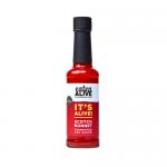 Clear 150ml glass bottle contains deep red-orange fermented sauce. Bold yellow-and-black label wraps the center with Eaten Alive name and scotch bonnet artwork. Black screw cap seals it. Visible seeds and tiny bubbles suspend in thick, clinging liquid.