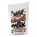 A glossy scatter of small, round milk chocolate buttons rests on a pale surface, their smooth domes catching soft light. A bright pouch stands behind them, displaying a cheerful logo and warm brown tones, with several buttons spilling from an opened corner. Soft shadows add depth and tiny highlights