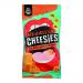 Bright red-orange single-serve Cheesies Red Leicester packets surround a small pile of popped cheese crisps. The crisps appear airy and uneven, with deep orange color and bubbled, crunchy surfaces; a branded carton sits behind.