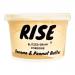 A RISE Instant Porridge Banana & Peanut Butter pot sits on a plain background. Bright yellow and beige packaging shows banana slices and a peanut-butter swirl beside steaming porridge; bold RISE branding, product name text and small icons form a clean, appetizing pack image. Subtle shadows add depth