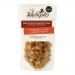 A kraft-style pouch displays the Joe & Seph’s logo above a clear window revealing glossy amber-coated popcorn studded with toasted pecan halves. Maple syrup glaze catches light, forming a sticky sheen; scattered pecans and caramelized kernels create a warm, rustic composition With warm nutty flecks