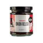 A clear glass jar of J & A Food Smoky Onion Relish shows a glossy, deep-brown, chunky condiment with visible caramelized onion strands and flecks of spice. A paper label wraps the jar in bold typography and a metal screw lid catches the light. Background is neutral and softly lit, revealing texture.