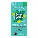 A neatly arranged scene shows three Seed & Bean chocolate bars in textured wrappers: Rich Milk 37% with Cornish sea salt & lime, an organic fair‑trade bar, and a 10‑seed variety. Partially unwrapped bars reveal glossy milk chocolate with sprinkled salt and lime zest. Thin salt veins plus lime flecks.