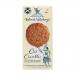 Image shows a 125g Island Bakery Oat Crumbles packet standing against a neutral background. The blue-and-white package displays the Island Bakery logo and bold product name; a clear window reveals coarse golden oat crumbles. Small icons and net weight line the lower edge.