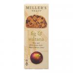 A neat stack of six round artisan toasts sits on a rustic wooden board. Each golden-brown biscuit has a crackled surface studded with fig slices and glossy sultanas. An open carton with muted, earthy packaging sits beside them, with soft natural lighting and simple styling.