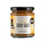 A glossy glass jar shows creamy peanut satay sauce in a warm tan color. The label features bold red and white lettering that reads J & A Food, with a small peanut illustration and Janda Chutney & Condiments branding. A silver metal lid caps the jar against a neutral background. Soft studio lighting.