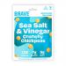 A compact 35g bag of Brave Roasted Chickpeas Salt & Vinegar sits upright, its matte pouch showing bold navy and white branding. Scattered golden roasted chickpeas and a few coarse salt flakes lie beside the open bag, while vinegar-splashed seasoning hints on the legumes. A faint sheen reveals crunch.