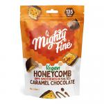 A photograph shows six Mighty Fine VEGAN Salted Caramel Honeycomb Dips 90g cups lined on a pale surface. Each cup features a brown-and-amber label with the brand logo, illustrated honeycomb pieces and caramel swirls, a vegan mark, and glossy highlights that accentuate crunchy texture.
