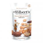 A set of twelve 100g Mr Filbert's Somerset Applewood Smoked Mixed Nuts packets arranged in a grid. Each pack displays the Mr Filbert's logo and product name, a clear window revealing almonds, cashews and mixed nuts, and a warm, smoky-toned label.