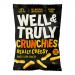 A compact rectangular box and ten individual bright yellow-orange packets of Well&Truly Crunchy Cheese Sticks sit side by side. Bold Well&Truly logo tops each pack, with stylized cheese graphics, crunchy stick images and small nutritional text lining the lower edge of the packaging. Glossy finish!!!