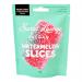 Bright pink pouches with green trim display Sweet Lounge branding and a watermelon illustration. Each 65g bag shows 'vegan' and 'fizzy' badges beside sparkling candy pieces. Ten identical packets arrange in a neat grid against a white background, casting soft shadows. Glossy finish, zip at top, seam.