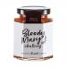Glass jar of Hawkshead Relish Bloody Mary Chutney sits upright, revealing chunky red and orange chutney flecked with herbs and spices. A cream label with bold black logo and red accents wraps the jar. Light reflects on the jar, and a neutral background frames it. Highlights rim the glass and labels.