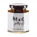 Six small glass jars of Hawkshead Relish mint jelly sit in neat rows. Clear jars reveal translucent pale green jelly; each jar has a white lid and a cream label with Hawkshead Relish branding. Soft lighting casts gentle reflections on the glass.