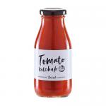 Six identical glass jars of deep-red tomato sauce display cream-and-green labels bearing the Hawkshead Relish name and product title. Metal lids glint, the glossy sauce is visible through clear glass, and jars sit grouped on a neutral surface under soft studio lighting that casts subtle reflections.