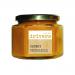 Six 350g glass jars of Drivers Chunky Piccalilli sit in a cardboard tray, each jar showing a bright mustard-yellow relish with visible vegetable chunks. Labels display the Drivers logo and product name; metal lids reflect light, creating a clean, grocery-shelf appearance. Glass jars show chunky veg
