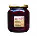 Six clear glass jars sit in a neat row, each showing chunky deep-magenta beetroot slices and pale-red onion ribbons suspended in translucent white wine vinegar. Plain white labels with black type and silver lids reflect light; glossy pickled juices catch bright highlights.