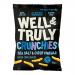 A bright turquoise-and-white 100g Well&Truly Crunchy Salt & Vinegar bag sits on a plain background. A bold navy logo and product name occupy the top, while an image of crinkled crisps, visible salt flakes and a vinegar splash fills the lower half.