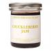A photo shows six glass jars of London Borough of Jam Chuckleberry Jam, each 220g, arranged in a neat pack. Deep purple jam fills clear jars with white lids and cream labels bearing a playful logo, berry illustration and simple black typography on a neutral background. Soft studio lighting highlights.