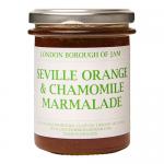 Six clear glass jars sit in neat rows, each filled with glossy amber-orange marmalade. Cream labels read 'London Borough of Jam' with botanical chamomile artwork and vintage typography. Metal lids catch light; citrus peel flecks and translucent gel texture show through the glass. Soft warm shadows..
