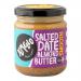 Six clear glass jars of Yumello Salted Date Almond Butter sit in a neat row; warm amber-brown spread shows creamy texture through the glass, each jar capped with a metallic lid and labeled with date and almond artwork.