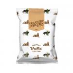 The photo shows twelve 45 g Dreamers Popcorn truffle-flavor bags arranged neatly; each small bag displays the Dreamers logo and dark, cream packaging with a truffle illustration. One open bag spills glossy, lightly seasoned popcorn against a clean white background.