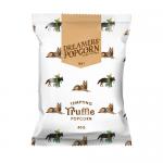 A photo shows 24 compact 20g Dreamers Popcorn bags arranged in a neat stack. Packaging displays a black-and-gold logo, a truffle-illustration and a clear window exposing pale, irregular popcorn pieces speckled with dark truffle flecks.