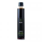 Image shows a slim 200ml dark glass bottle of The Wasabi Company organic soy sauce with a black screw cap. A green-and-white label bears the brand logo and product name; deep brown liquid fills the bottle. The bottle sits against a plain neutral background.