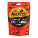 The image shows a 63g packet of Joe & Seph’s Dark Chocolate Popcorn Bites. A matte pouch features the brand logo and dark brown, cream accents; glossy, chocolate-coated popcorn clusters appear through a clear window.