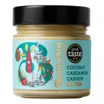 Ten 180g glass jars of Butternut of London Coconut Cardamom Cashew Butter sit on a clean white surface. Pale creamy nut butter with flecks shows through the jars; labels display warm brown and cream tones with coconut and cardamom illustrations.