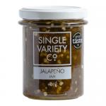 Six clear glass jars of jalapeño jam sit on a neutral backdrop. Bright green, chunky jam reveals pepper flecks and seeds. Each jar bears a simple white Single Variety Co label and a matte black screw lid, arranged neatly.