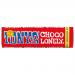 A bright, glossy wrapper displays the bold Tony's Chocolonely logo across its center. A stylized milk chocolate bar with uneven, chunky segments appears alongside handwritten-style flavor text and graphic accents. The packaging rests flat on a neutral, lightly textured background with soft shadows.