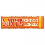 The photo shows a bright red wrapper with a bold yellow logo reading 'Tony's' across the center. Diagonal yellow stripes and a small blue panel highlight flavor text. A segmented chocolate bar peeks from torn foil, revealing glossy milk chocolate with caramel ribbons and scattered sea salt crystals.