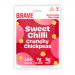 An open display box holds twelve 35g Brave Roasted Chickpeas Sweet Chilli packets. Each bright red-orange sachet features the Brave wordmark, prominent 'Sweet Chilli' label, a detailed photo of roasted chickpeas sprinkled with chilli flakes, and small icons and nutrition text along the base. box top