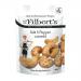 An open carton of 20 individual 40g Mr Filberts Salt & Black Pepper Cashews sits on a surface, revealing foil-sealed packs. Each packet displays the Mr Filberts logo, an image of roasted cashews, scattered peppercorns and salt crystals on a warm, earthy background.