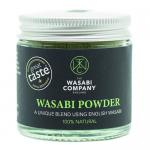 Six small green packets of The Wasabi Company Wasabi Powder (23g) sit alongside a chutney & condiments sleeve. Packaging features a bold green-and-white logo, clear weight text, stylized wasabi root and leaf illustrations, and neat product information panels.