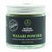 Six small green packets of The Wasabi Company Wasabi Powder (23g) sit alongside a chutney & condiments sleeve. Packaging features a bold green-and-white logo, clear weight text, stylized wasabi root and leaf illustrations, and neat product information panels.