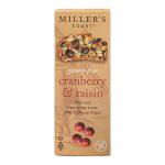 A bright packet shows six thin, golden-brown Miller’s toast slices studded with dried cranberries and dark raisins. The label displays Artisan Biscuits branding and a clear gluten-free note, while the transparent window reveals the crisp, speckled textures of each toast. Light catches berry flecks.